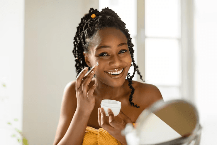 Creator smiling while applying a skincare product she sells from her storefront