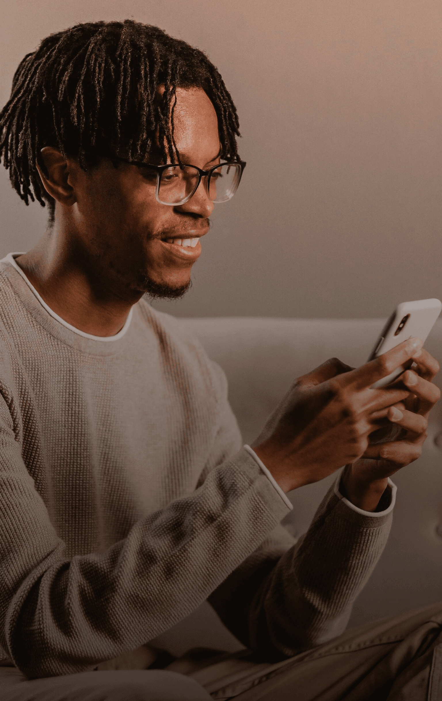 Fan smiling at his phone while sending a creator a tip